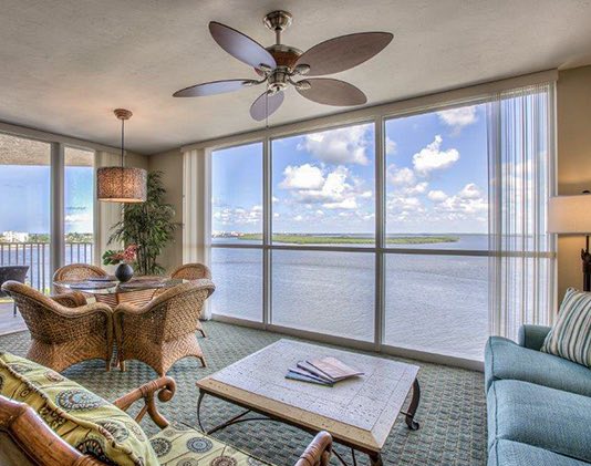 Room with living space overlooking body of water