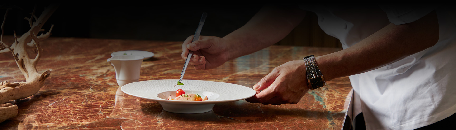 the chef plating food