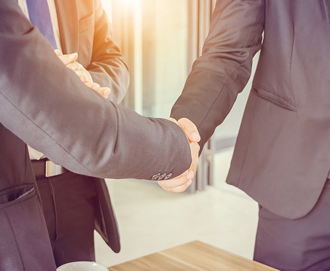 two professionals shaking hands