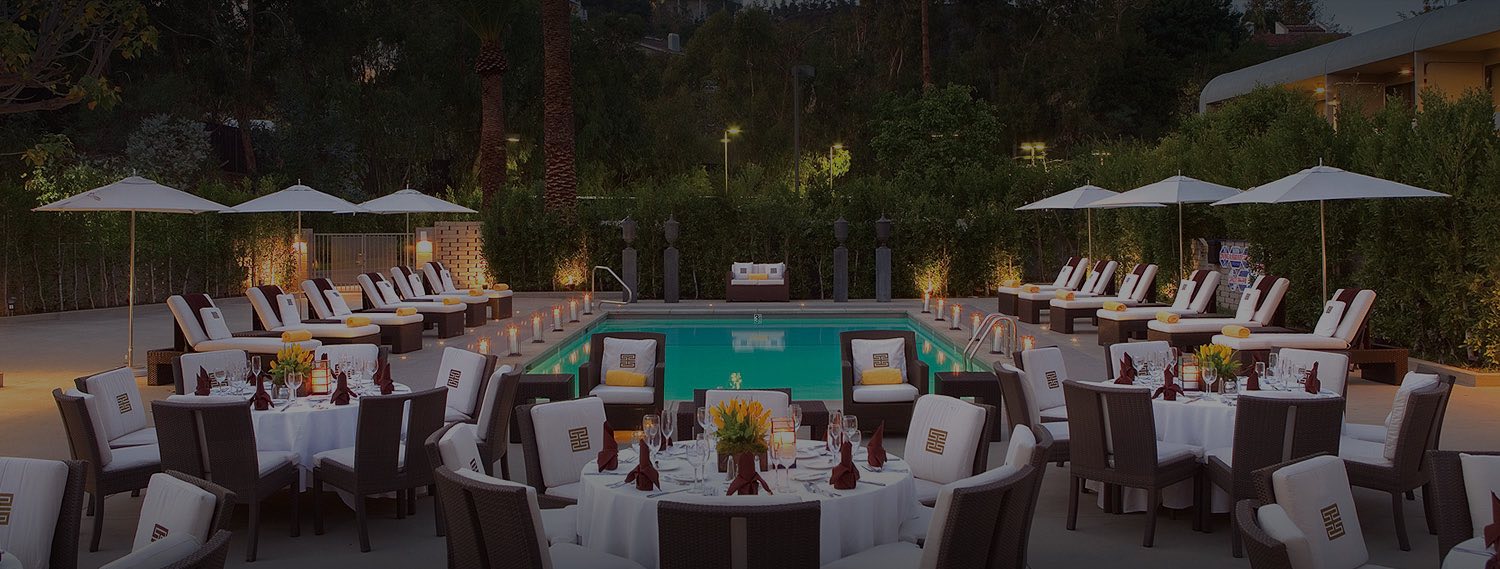 Tables set for meal next to the outdoor pool
