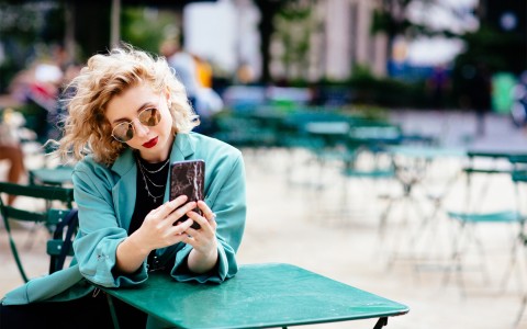 woman with her cellphone on her hands