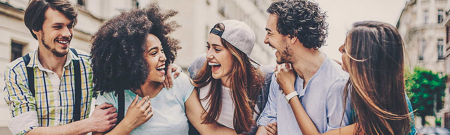 group of friends laughing and sightseeing