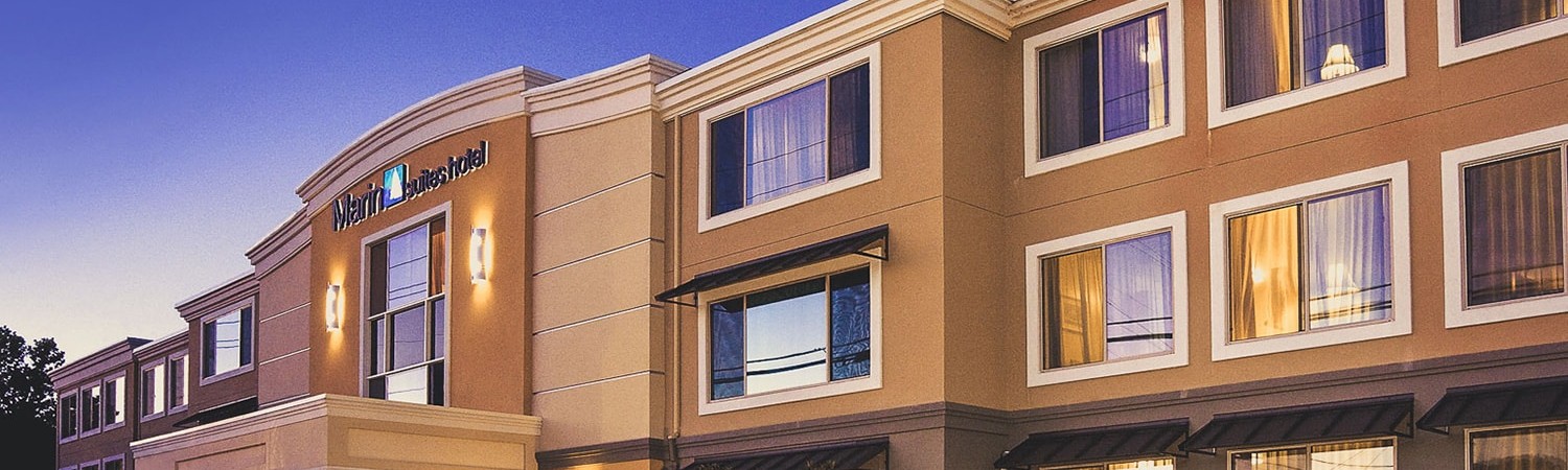 evening exterior shot of marin suites