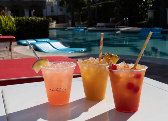 colorful drinks on table by the pool