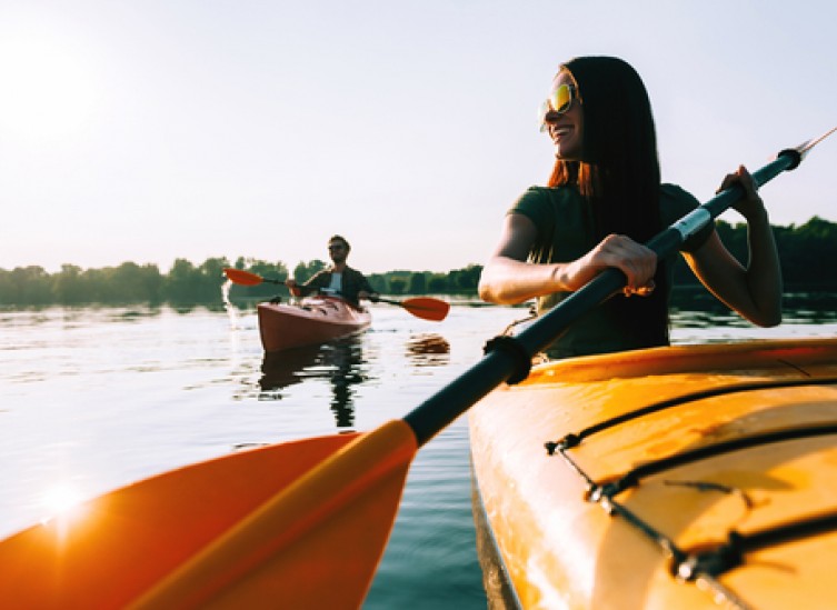 couple kayaking in calm waters