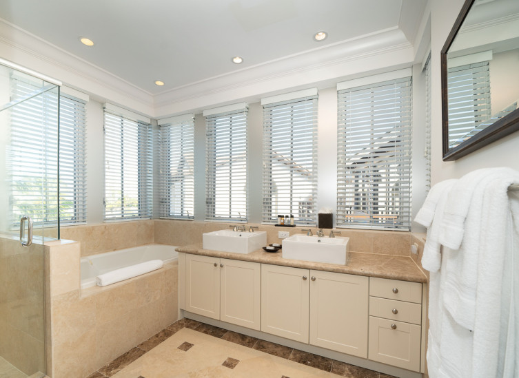 Full bathroom with vanity, tub and glass door shower