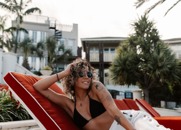 woman on pool lounge chair 