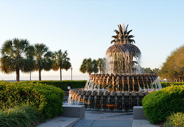 view of a pineapple fountain by the coast