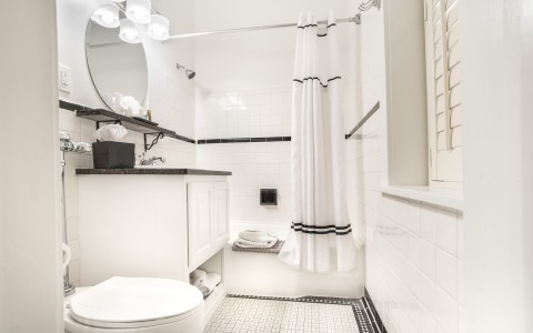 a white bathroom with large shower