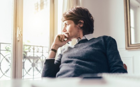 a man looking out the window