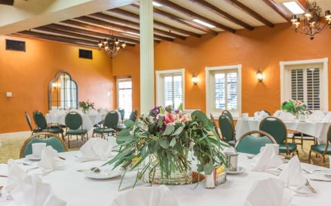a banquet table with floral centerpieces