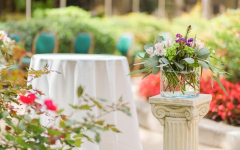 a cocktail table with floral arrangements