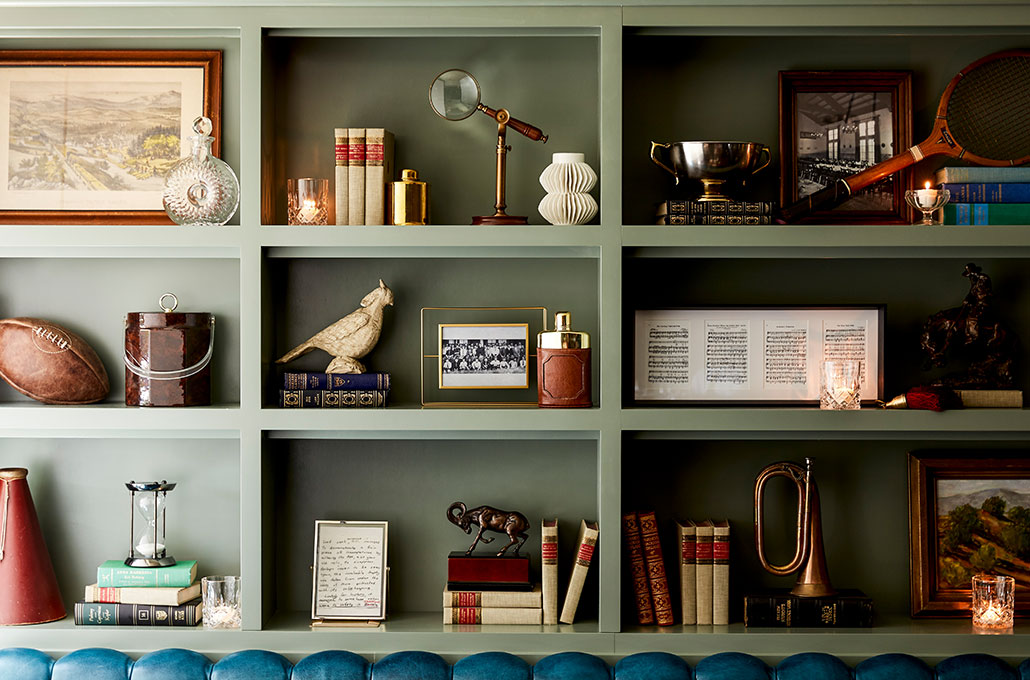 green shelves with trinkets 