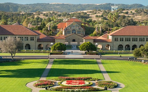 Stanford university grassy knoll with buildings
