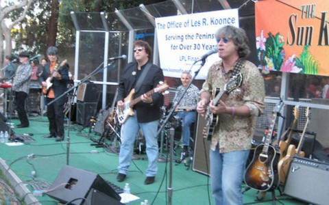 band plating live music on side walk in outdoor festival