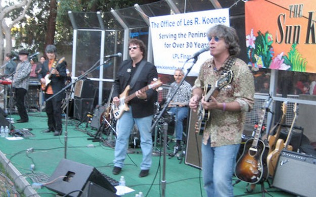 band plating live music on side walk in outdoor festival