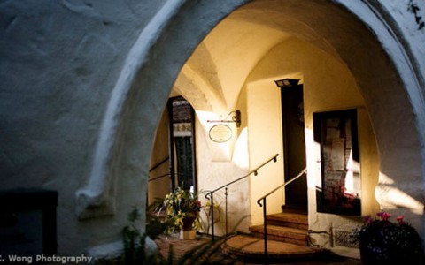 arched way leading to front door.