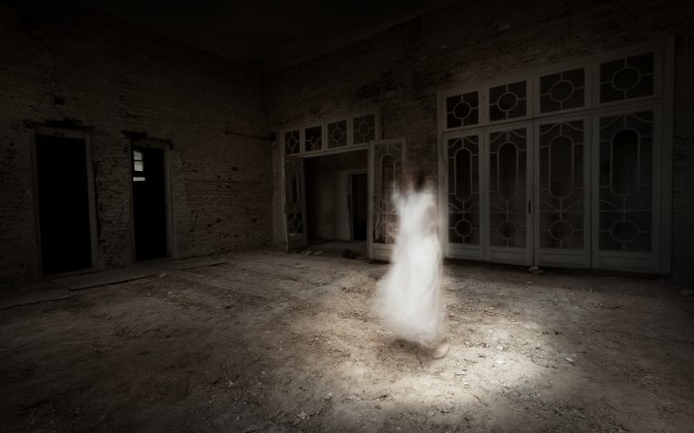 what appears to be a ghost of a women in a dilapidated building