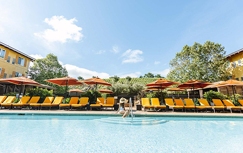 Image of woman sitting by pool
