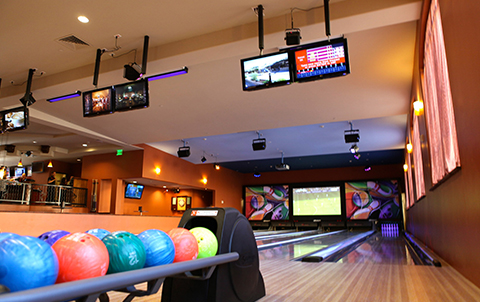 A bowling alley with colorful bowling balls