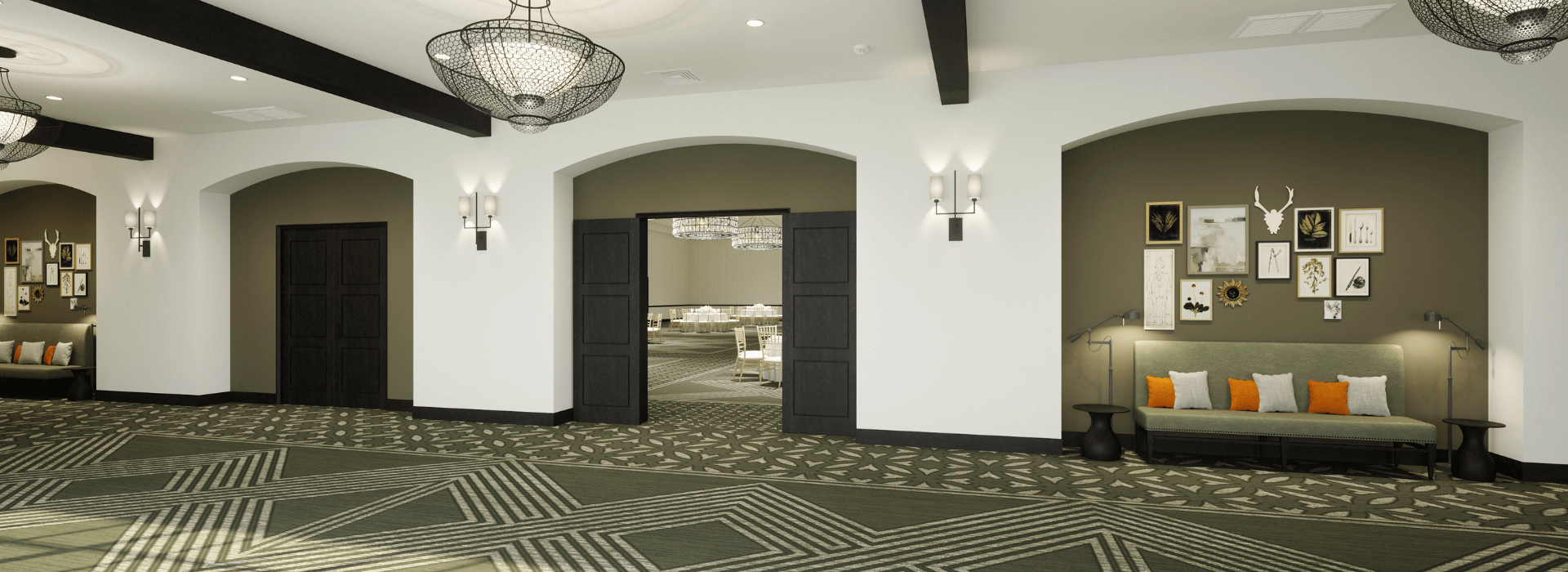 Ballroom with a green patterned carpet and two couches
