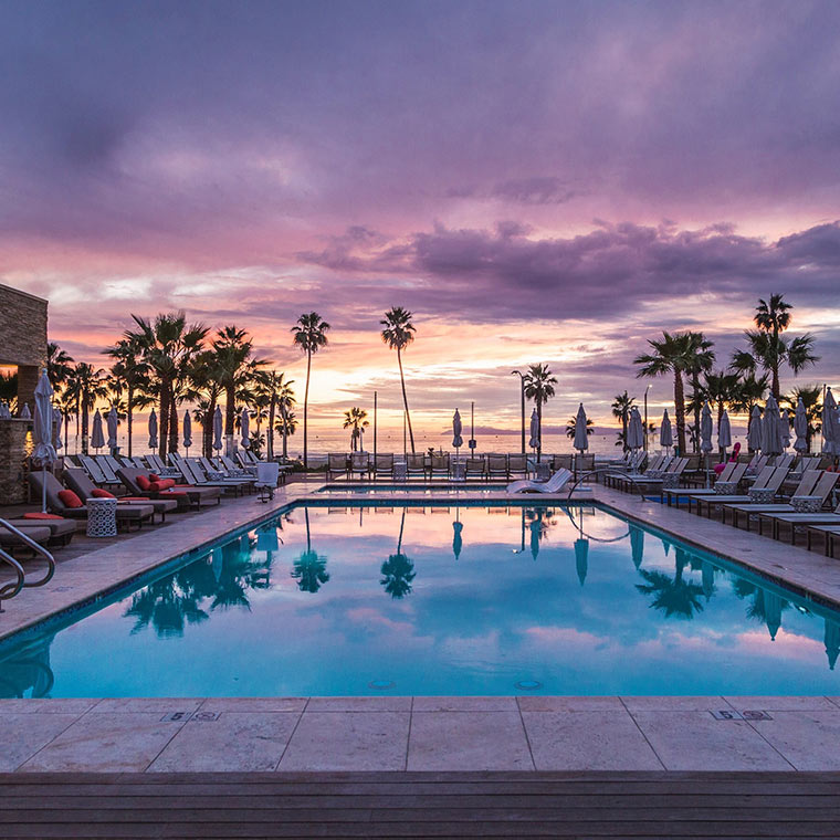 View of resort pool during a beautiful sunset