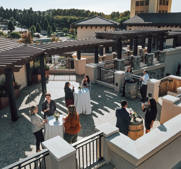 People gathering on a rooftop terrace 