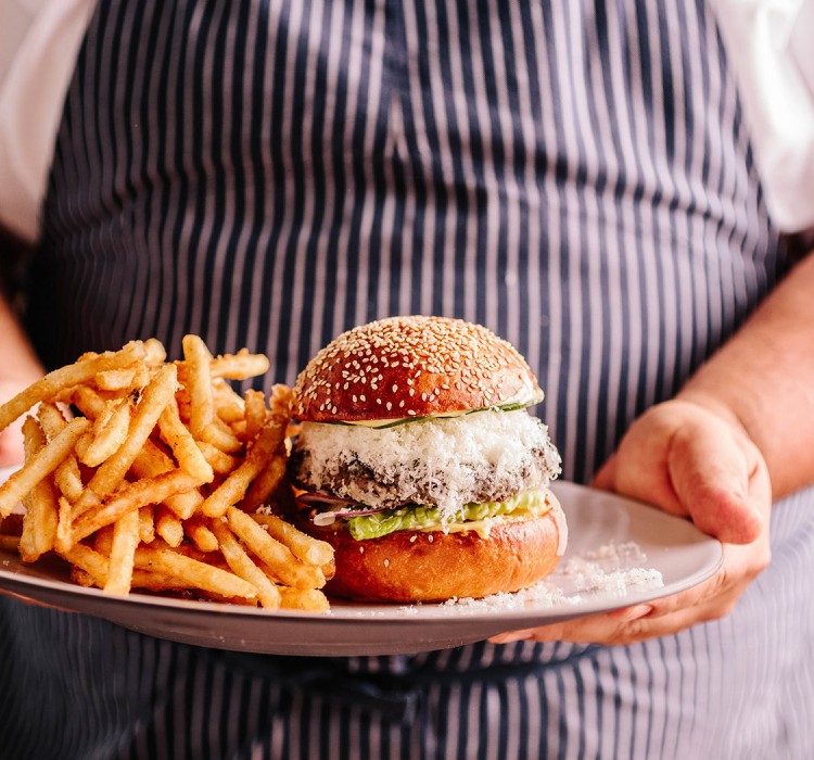 Large plate of friends and a hamburger 