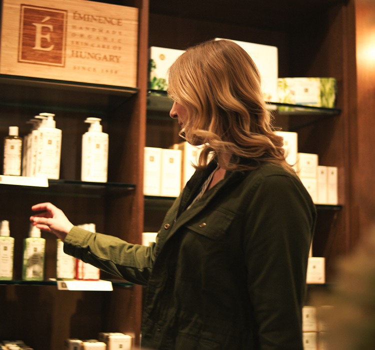 woman shopping different spa products at the shop