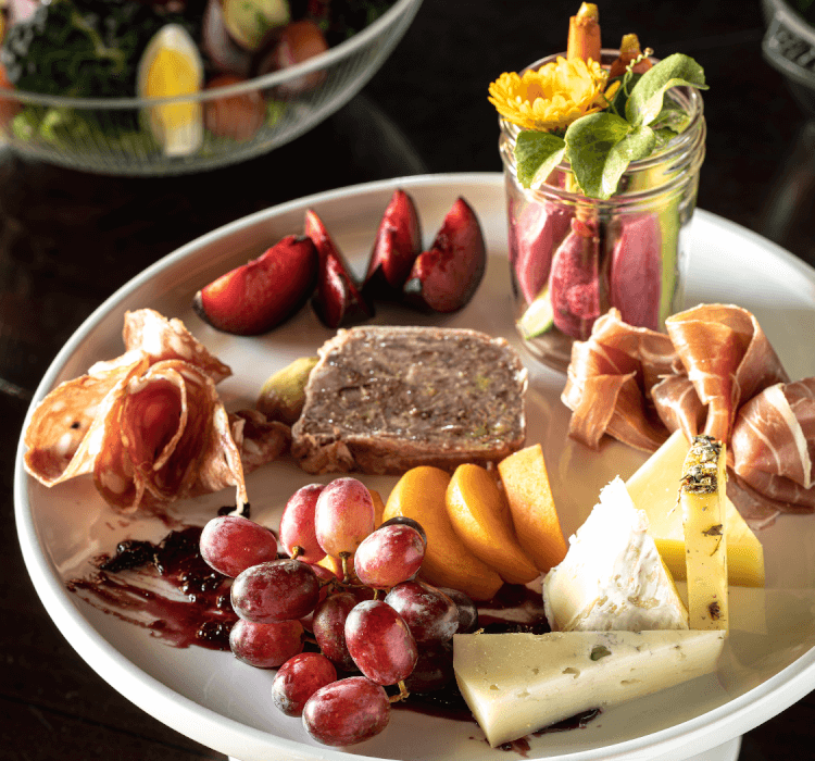 Plate of assorted meats, cheeses and fruits