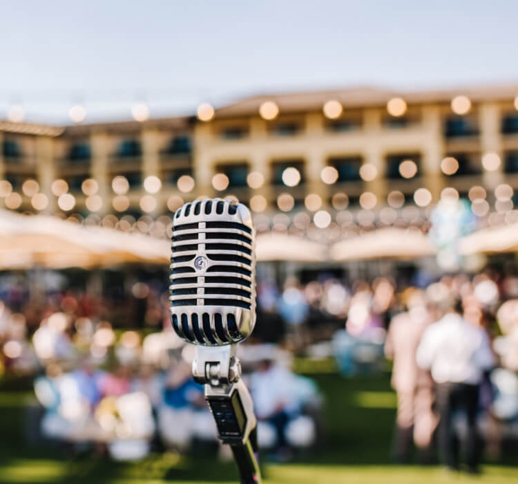 Microphone with blurred audience