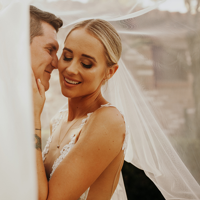 Woman in a wedding dress with her husband