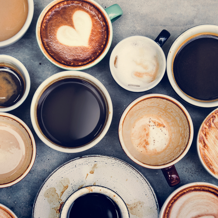 Several empty and filled coffee mugs