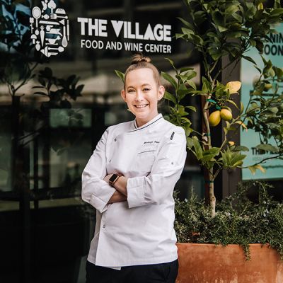 Chef in front the Village food and wine center
