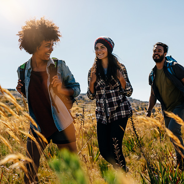 Group of friends hiking up the mountain