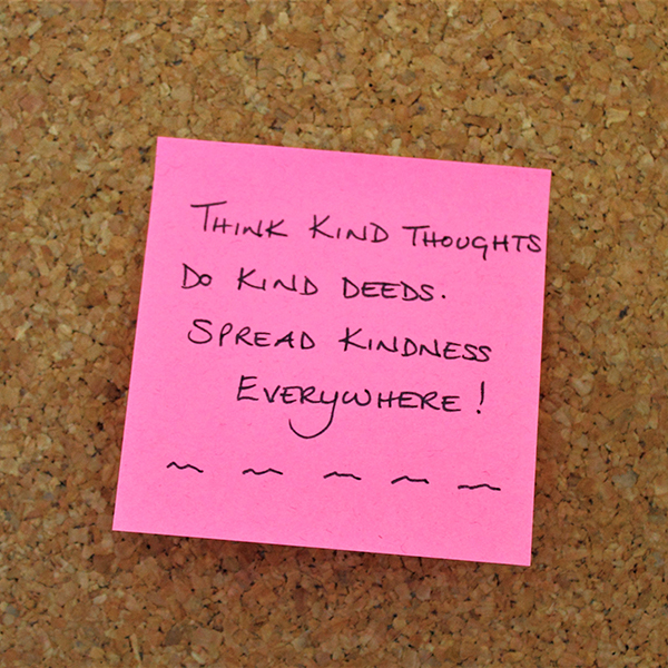 Pink post it note with writing on it