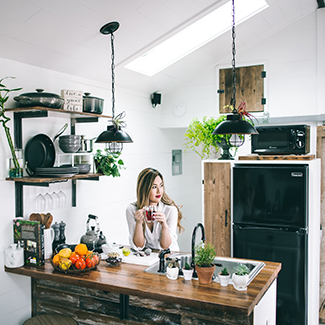 Woman having breakfast in a kitchen
