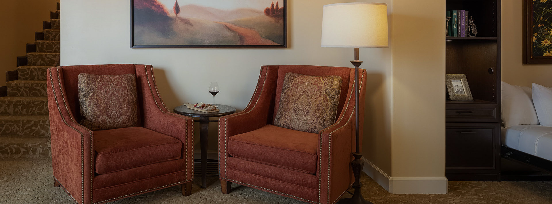 Seating area with two comfy red chairs
