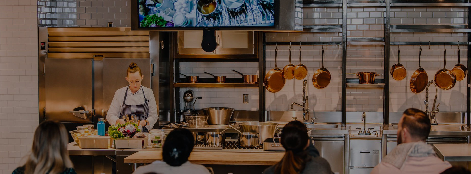 Chef teaching a cooking class in a kitchen