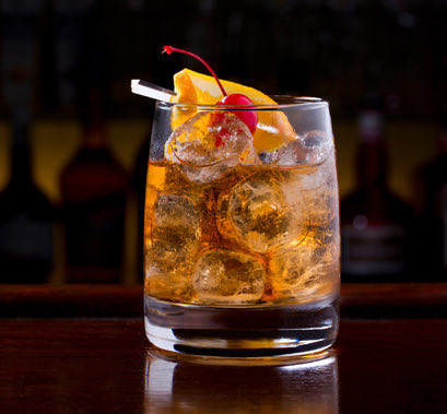 A beverage with a cherry on top