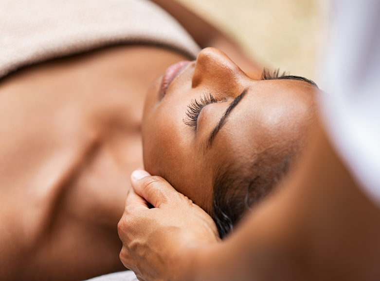 young woman getting a facial treatment at the meritage spa