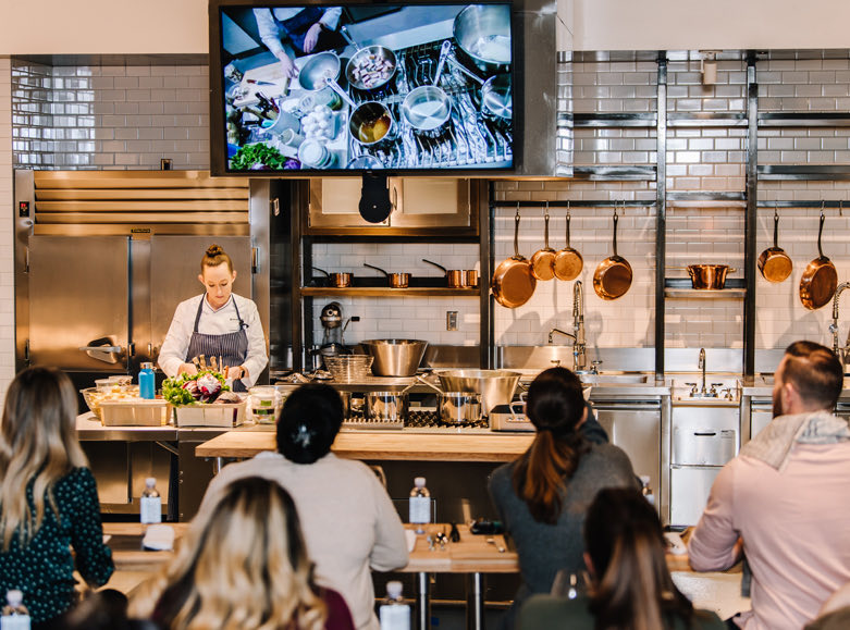 Chef teaching a class to a group of people