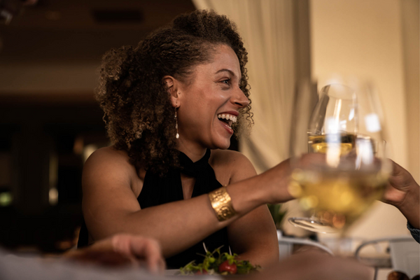Womend toasts with white wine