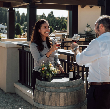 Couple having a glass of wine outside