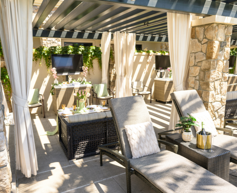 View of Grand Reserve pool cabana with two lounge chairs and a sofa