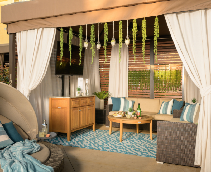 View of hideaway cabana with a sofa and tv
