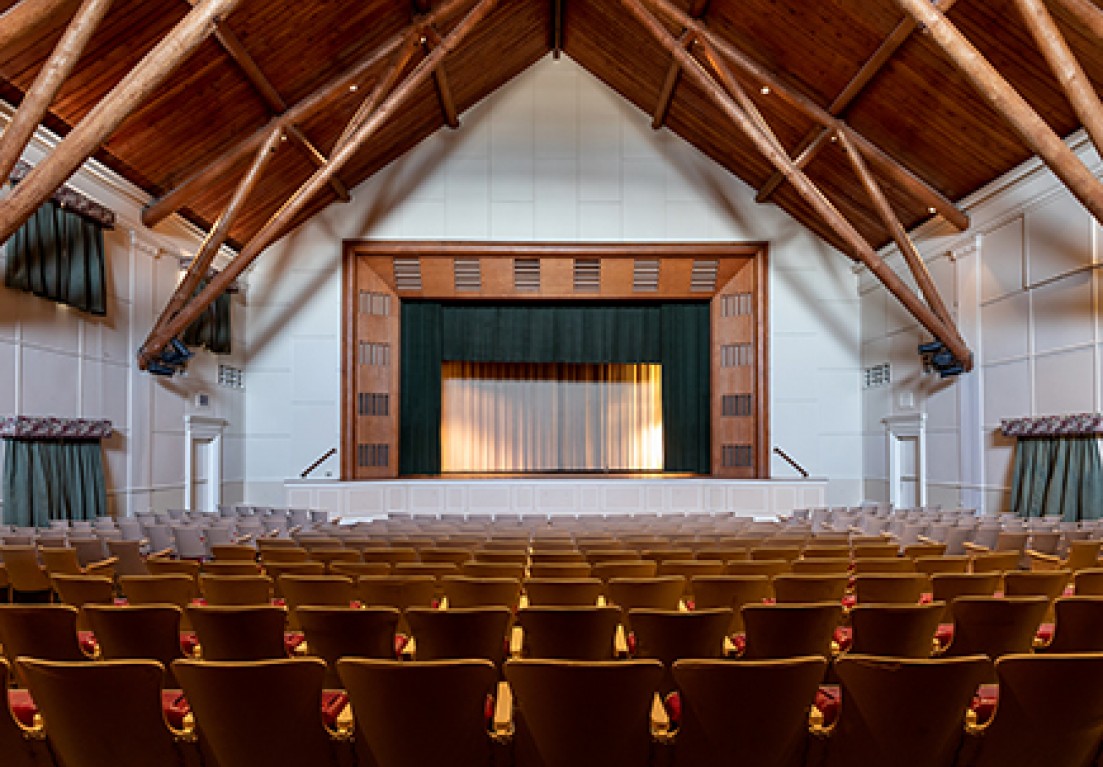 view of an empty theater with wooden ceiling