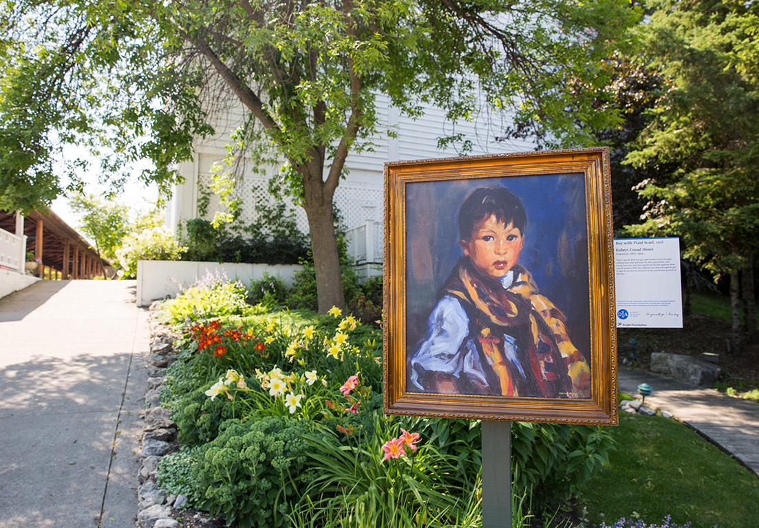 close up of a portrait of a young boy outside