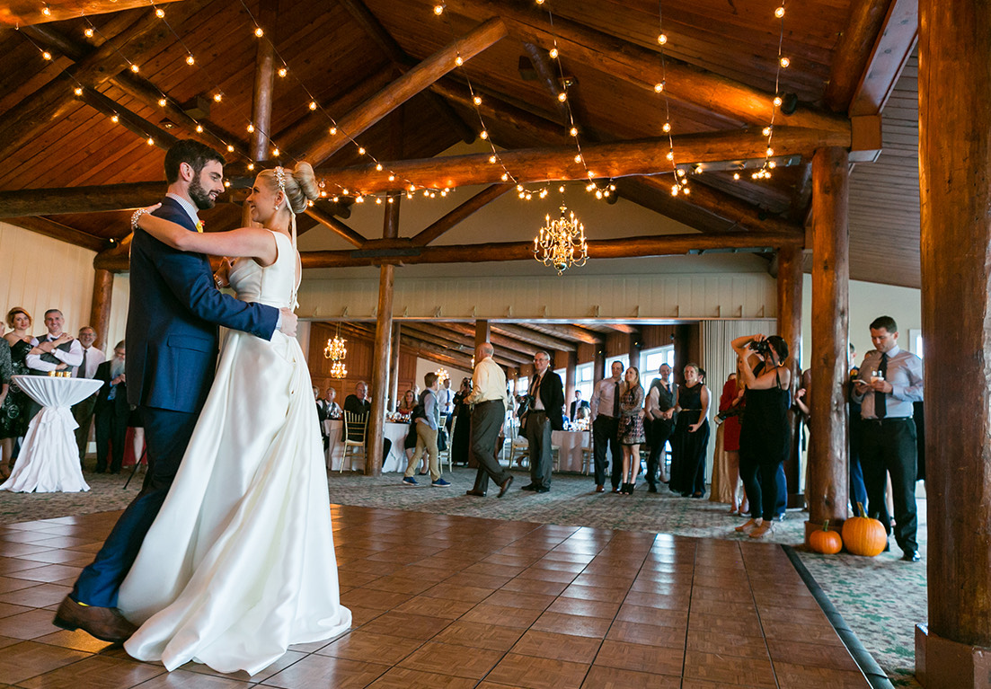 bride and groom looking at each other while dancing