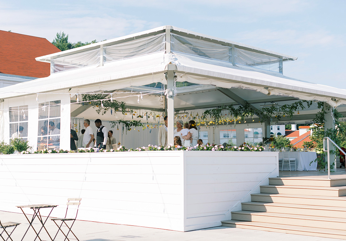 outdoor wedding venue with flowers hanging from the ceiling